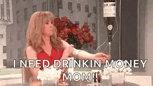 a woman is sitting at a table with a bottle of wine in her hand and says `` i need drinkin money mom '' .