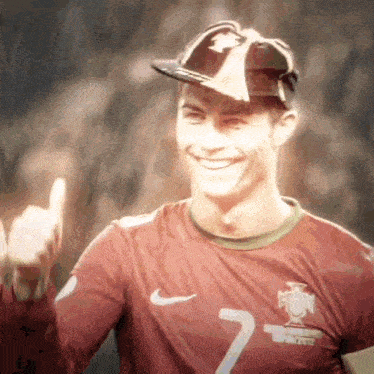 a soccer player wearing a hat and sunglasses with the number 7 on his jersey