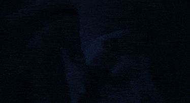 a dark blue background with a hand visible