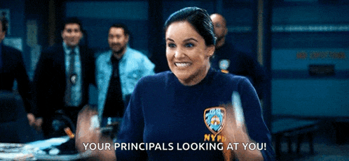 a woman in a nypd shirt is giving a thumbs up