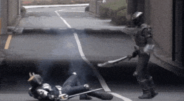 a person in a knight costume is laying on the ground