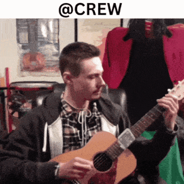 a man is playing an acoustic guitar with the word crew above him