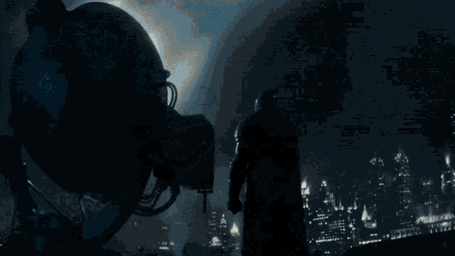a man in a batman costume stands in front of a spotlight