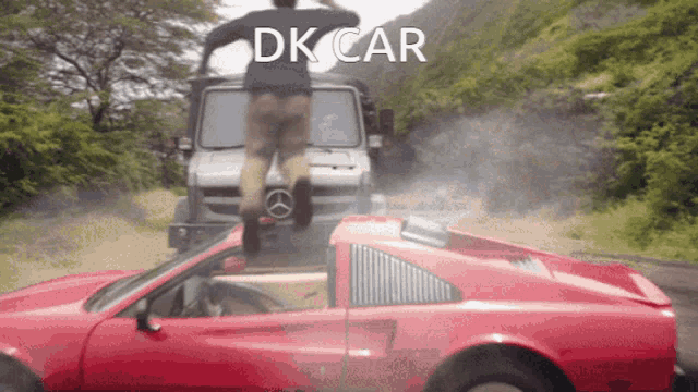 a man is jumping over a red car with the words dk car written above him