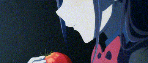 a woman with long blue hair is holding a tomato in her hand .