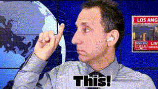 a man wearing ear buds and a tie says " this "