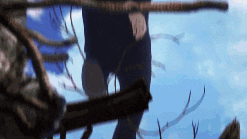a person is walking across a rope with a blue sky behind them