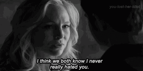 a black and white photo of a woman and a man with the caption i think we both know i never really hated you .