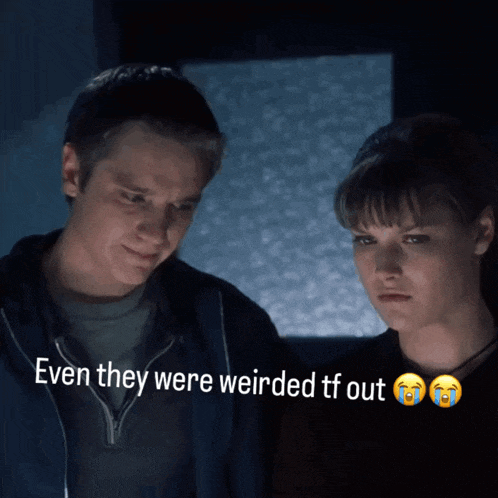 a man and a woman looking at something with the words even they were weirded tf out below them