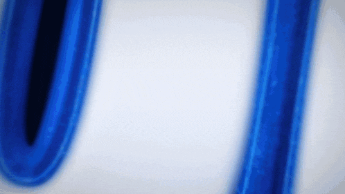 the letter u is painted in blue on a white background