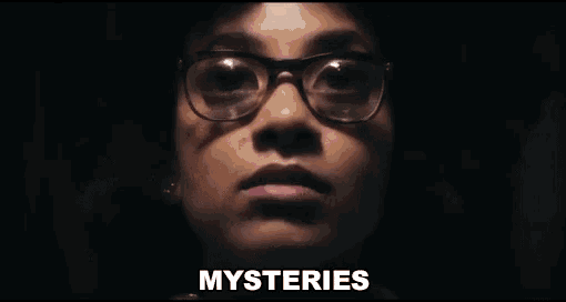 a close up of a woman 's face with the word mysteries written below her