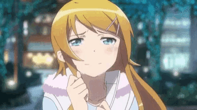 a girl with blonde hair and blue eyes is making a sad face while holding her hand to her face .