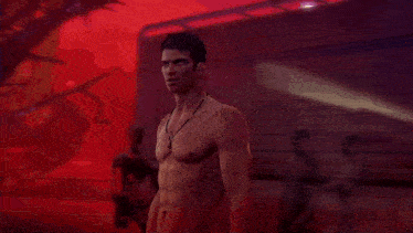 a shirtless man stands in front of a trailer