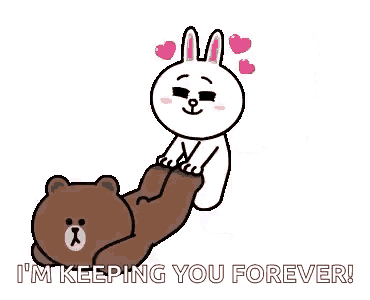 a brown bear and a white rabbit are laying on a bed .