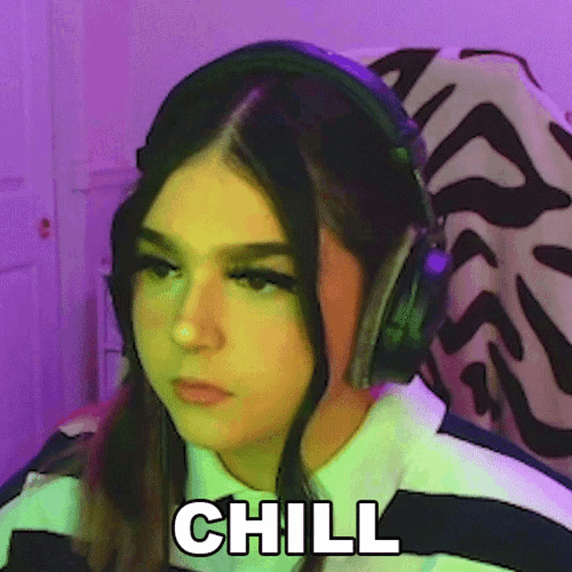 a girl wearing headphones with the word chill written on it