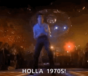 a man is dancing on a dance floor in front of a disco ball in a club .