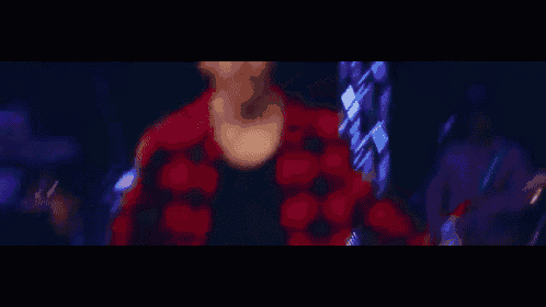 a blurry picture of a person in a red jacket