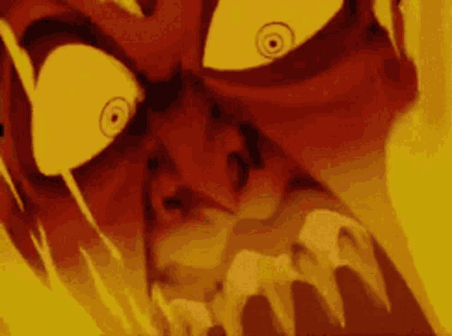 a close up of a cartoon character 's face with fire coming out of it 's mouth .