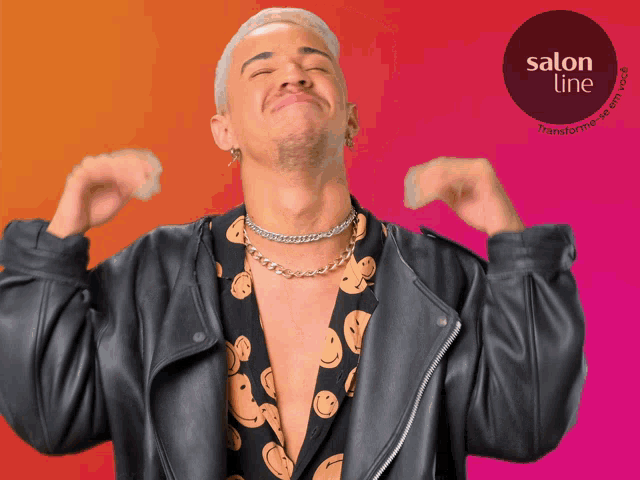 a man wearing a leather jacket and a shirt with smiley faces on it