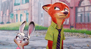 a fox and a rabbit are standing next to each other on a sidewalk in front of a building .