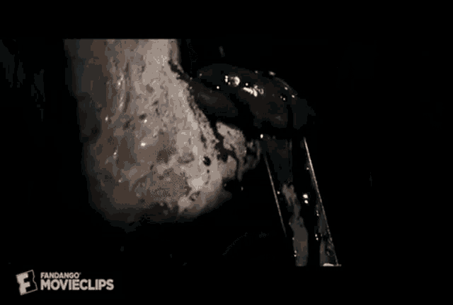 a close up of a person 's mouth with blood coming out of it