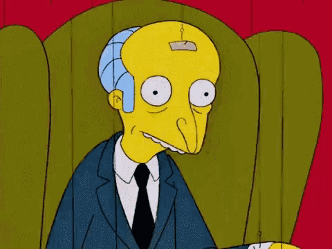 a cartoon character with a patch on his head is sitting in a chair