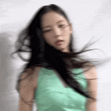 a blurry picture of a woman with long black hair