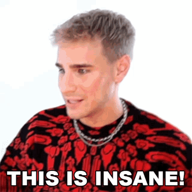 a man wearing a red and black sweater and a chain around his neck says this is insane !