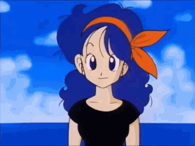 a cartoon character with blue hair and an orange headband is standing in front of the ocean .