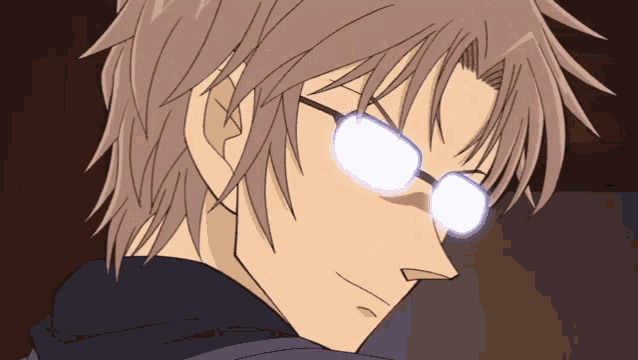 a close up of a person wearing glasses and a black jacket