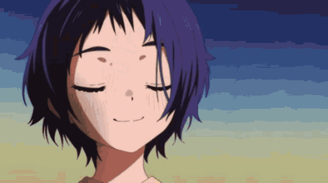 a close up of a girl with her eyes closed smiling