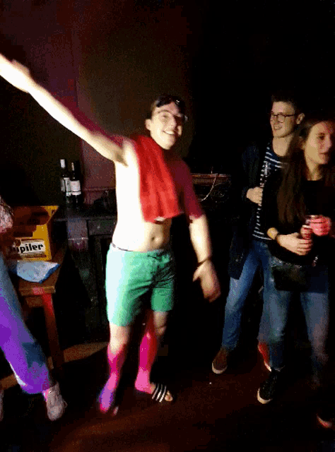 a man dancing in front of a crate of jupiler