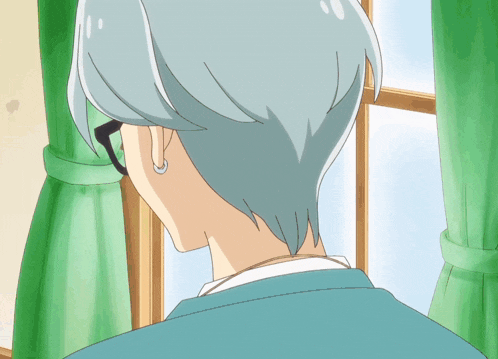 a person with gray hair looks out a window