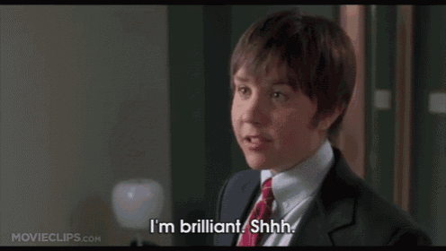 a man in a suit says i 'm brilliant shh