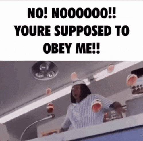 a woman in a striped shirt is standing in front of a microphone with a sign that says no !