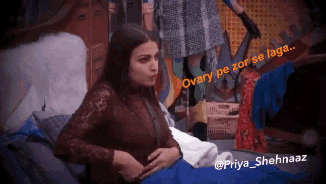 a woman is laying on a bed with a caption that says ovary pe zor se laga ..