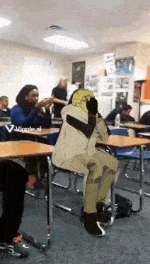 a person is sitting on a chair in a classroom with a banana on their head .