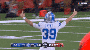 a football player with the number 39 on his jersey is giving the middle finger