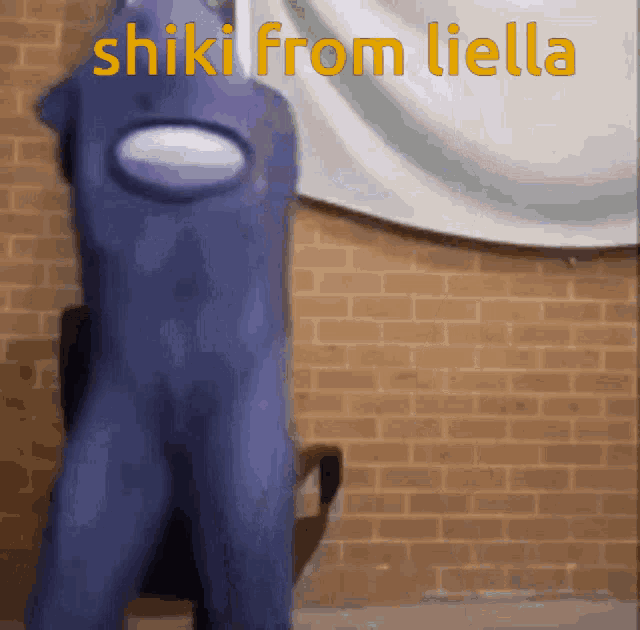 a purple among us character standing in front of a brick wall