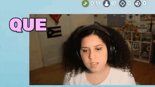 a woman wearing headphones with the word que in the corner