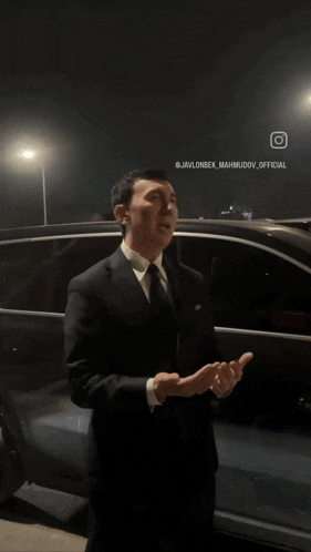 a group of men are standing in front of a car with the hashtag @javalonsek_mammudov_official on the bottom