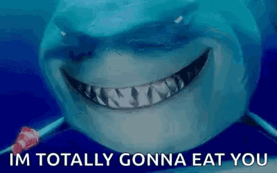 a shark with a lollipop in its mouth and the words `` im totally gonna eat you '' written below it .