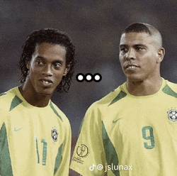 two soccer players wearing yellow jerseys one with the number 9