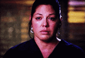 a close up of a woman 's face with tears running down her face