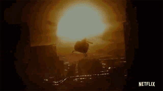 a helicopter is flying over a city with a netflix logo on the bottom right