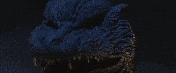 a close up of a dragon 's eye with a red glow coming out of it .