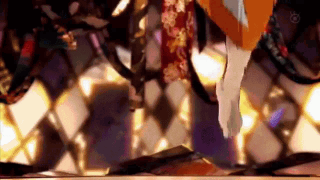 a close up of a person 's feet in a kimono on a checkered floor .