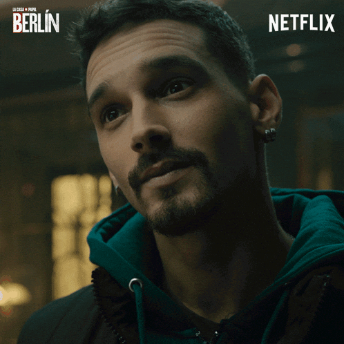 a close up of a man 's face with a netflix logo in the background
