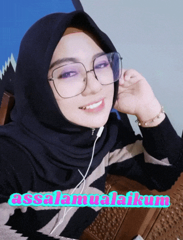 a woman wearing glasses and a hijab with the words assalamualaikum on the bottom right