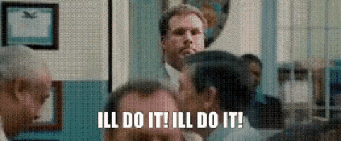 a man is standing in a crowd of people and says `` ill do it , ill do it ! ''